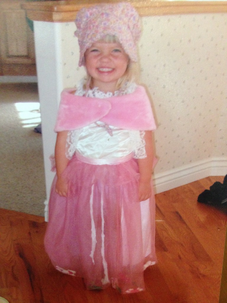 Smiling little Rebecca in costume