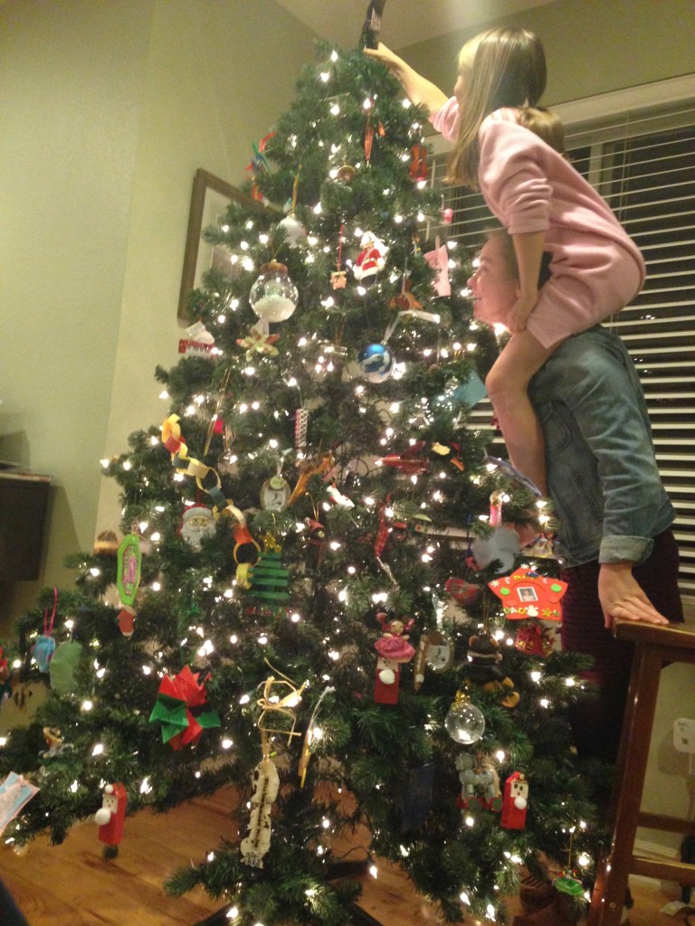 putting the star on the Christmas tree 2014