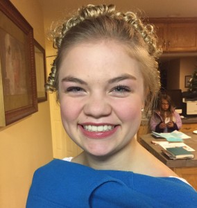Right before walking out the door to perform. Happy girl!